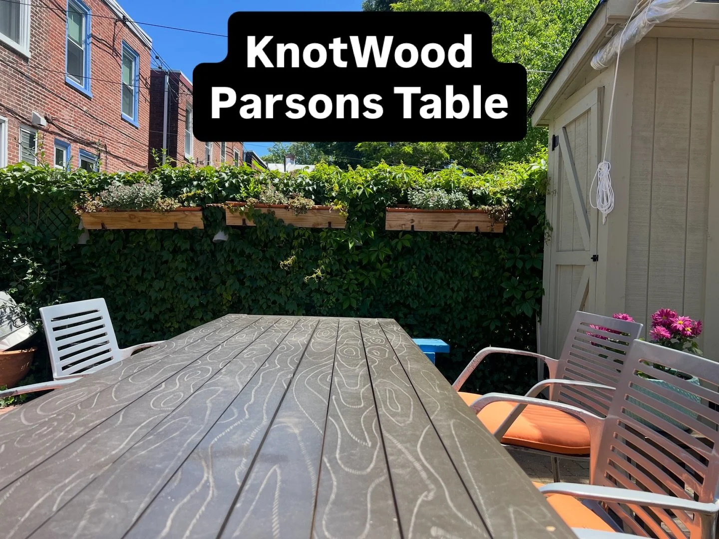 KnotWood Parsons Table.  Hand carved wood grain on aluminum planks.  Traditional parsons table style and build. Powder finished in pretty much any color you desire. Shown here in a deep bronze, but how cool in magenta or mustard yellow?!? Perfect for