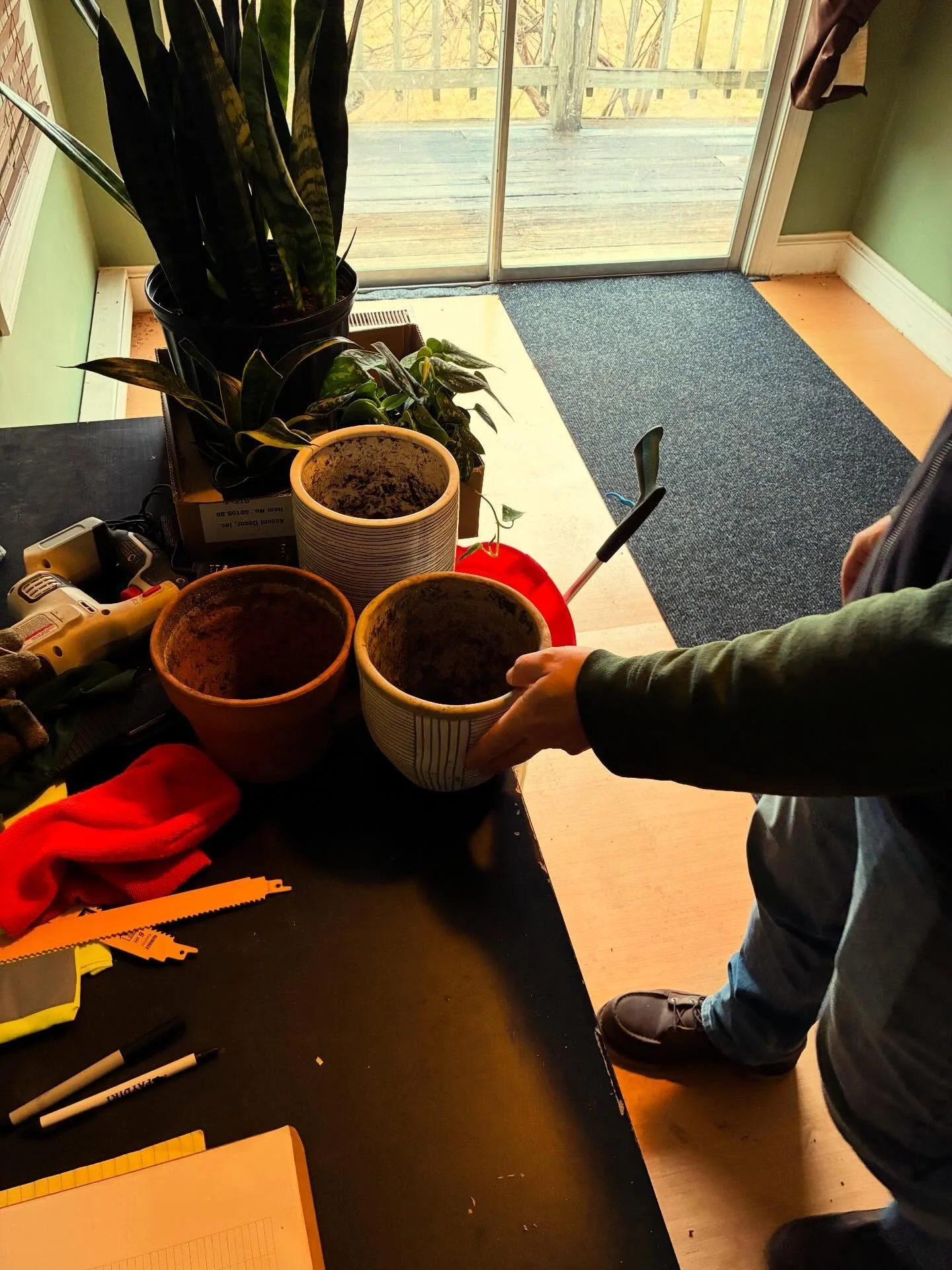Adam putting together some fresh potted plants for our office. Compost is a great way to give your potting soil a boost! You can add up to 50% compost to keep your indoor plants healthy all year long and we have options if you only need a little at a