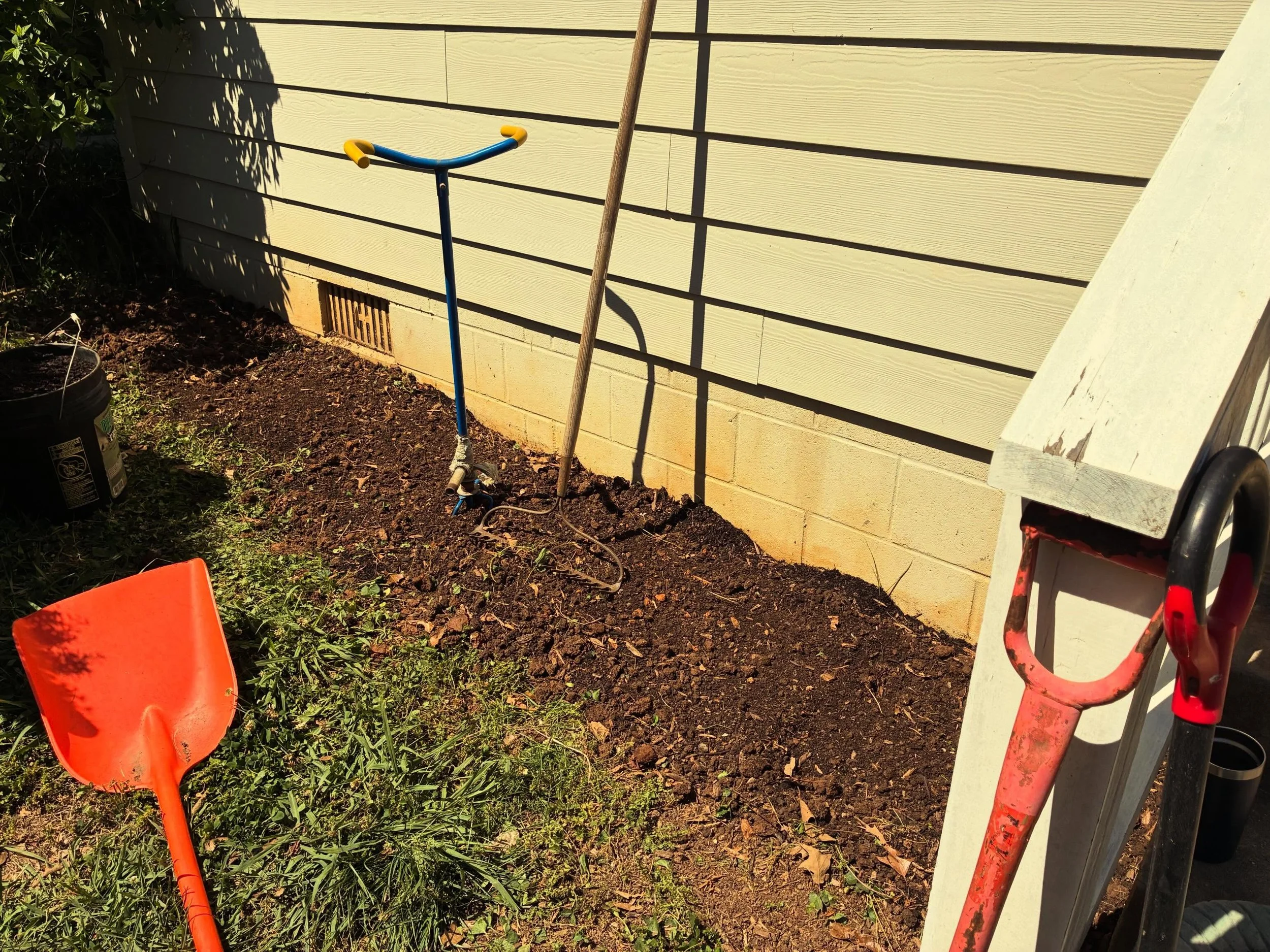 A simple project that makes a big difference! This client ripped out some boxwoods that were not doing well, tilled some Paydirt Compost into the bed, created a simple edge with some stones from the back yard, dropped in some veggie and berry plants,
