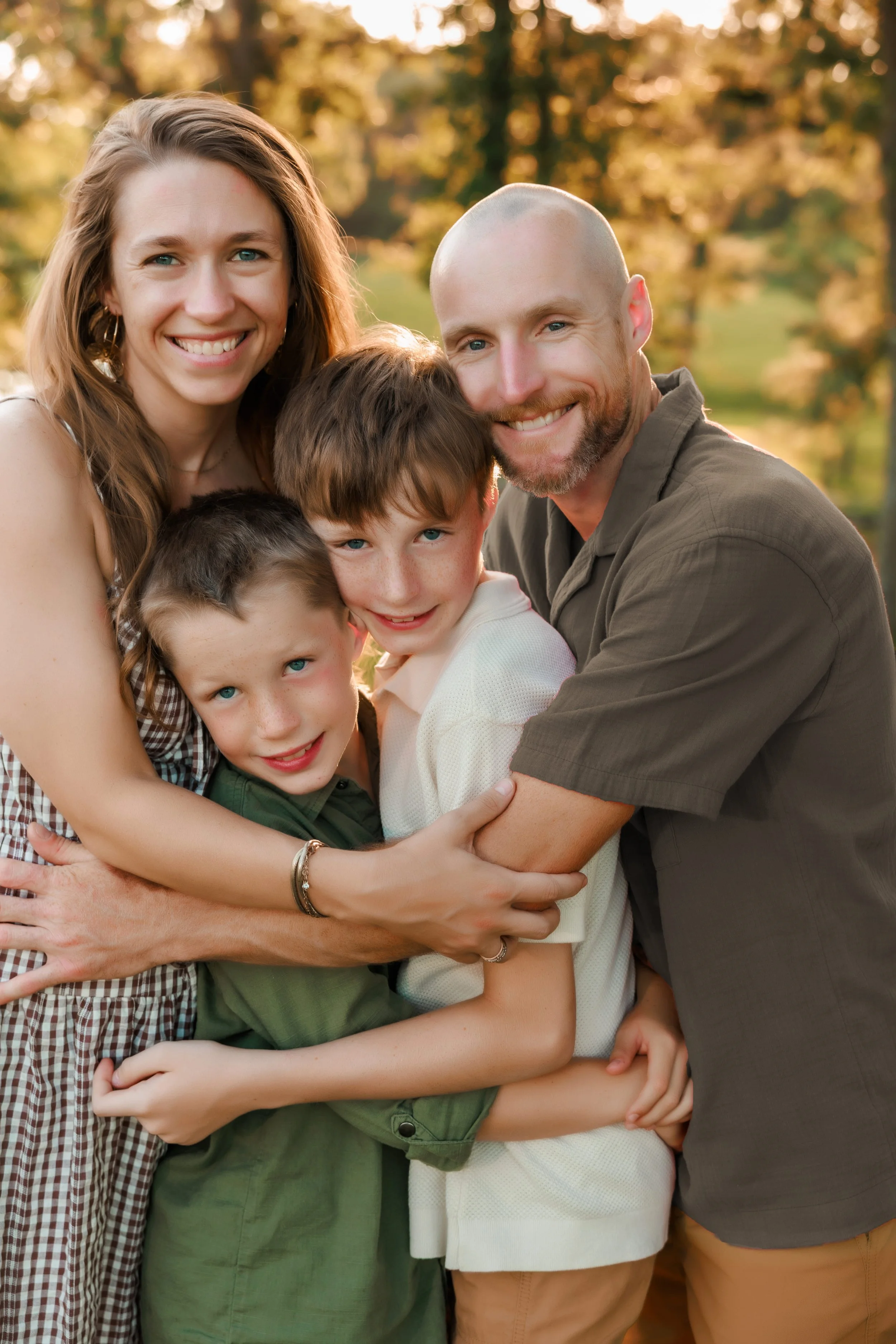   "Kansas City family photographer - family in neutral outfits at outdoor session"  