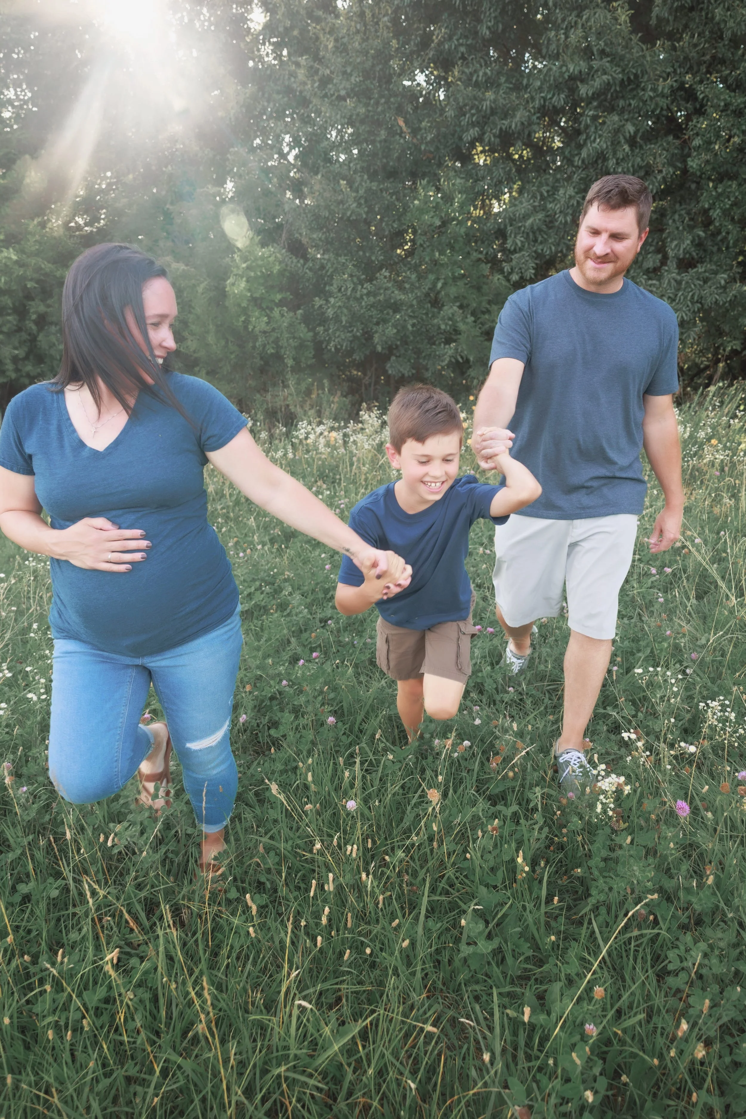   casual family maternity photo outdoors in natural light  