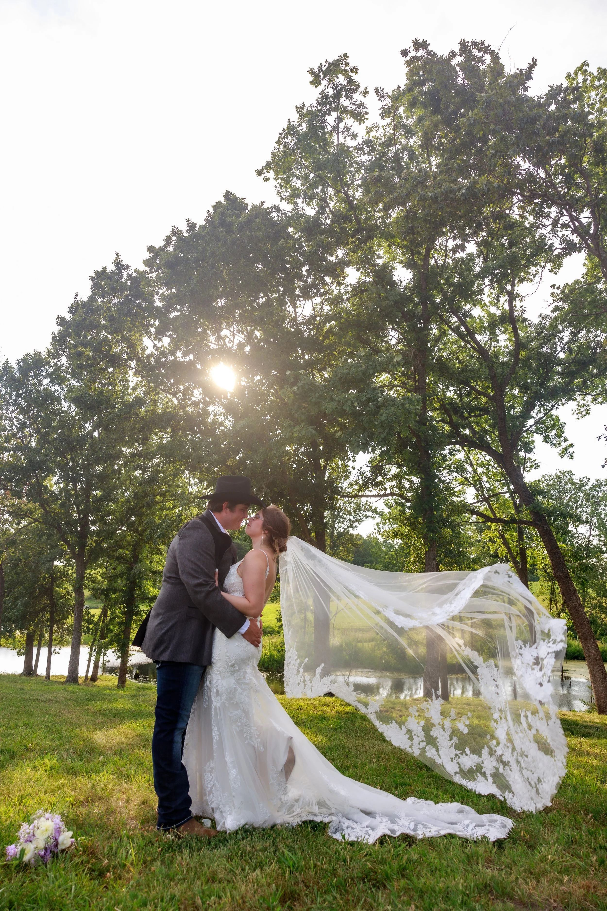 a bride and groom embraced for a photo near kansas city mo