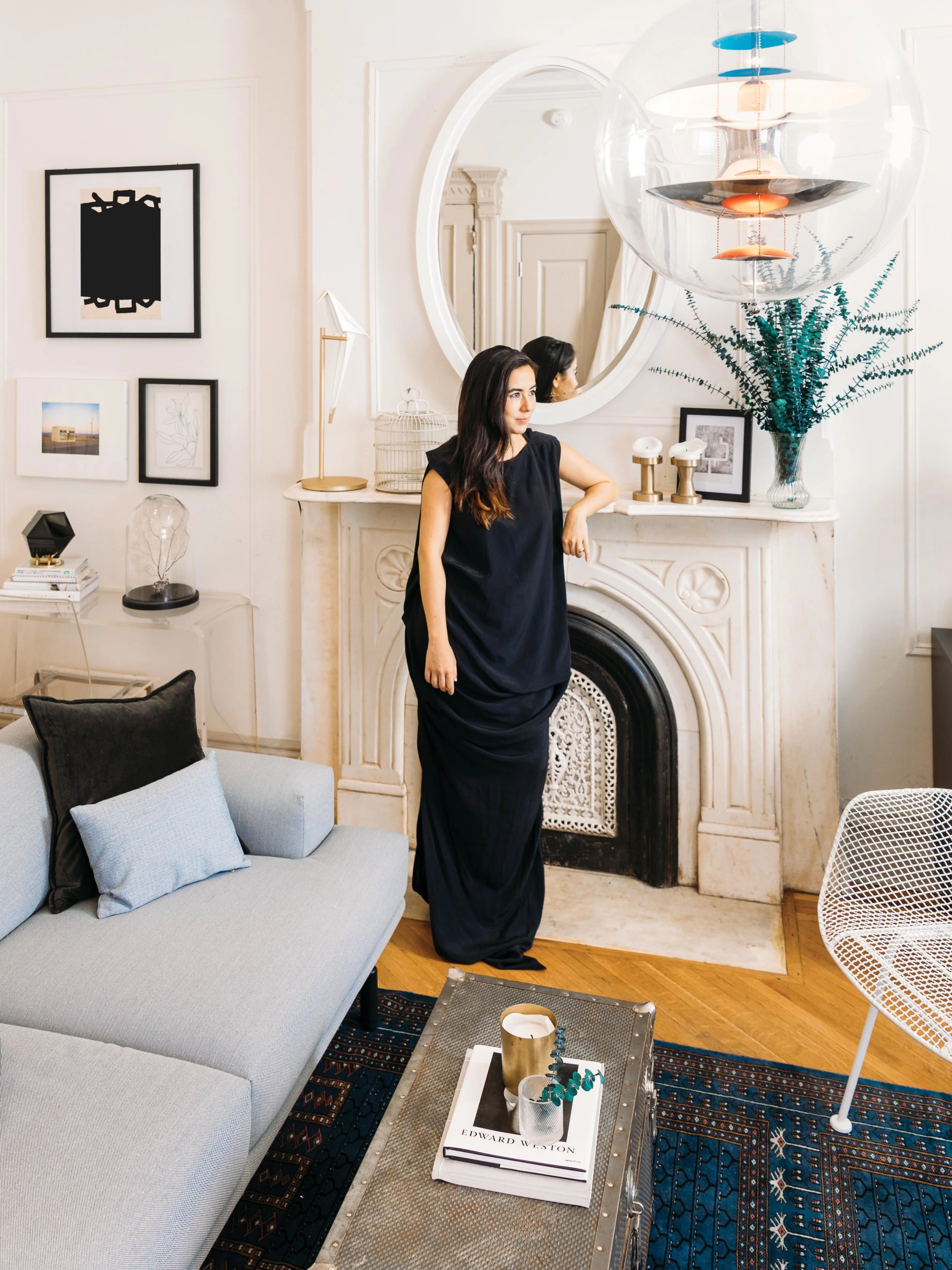 Bedford Stuyvesant Brownstone VP Globe Pendant Light by Verner Panton from Verpan. Compose sofa by Muuto. Sculptura occasional chair by Russell Woodard. Vintage chest and rug, Welles Double Blown Desk Lamp by Gabriel Scott. Eduardo Chillida prints. Paper Mirror, Perch Table Lamp by Moooi. Brass candle holders by Megan Grehl. Photo: Zack DeZon.