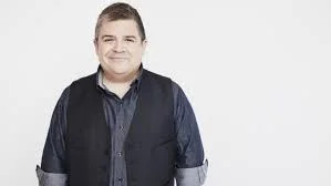 Paton Oswalt.   Slowly unveils the Shadow behind masks.  Pick any clip. He rocks. 