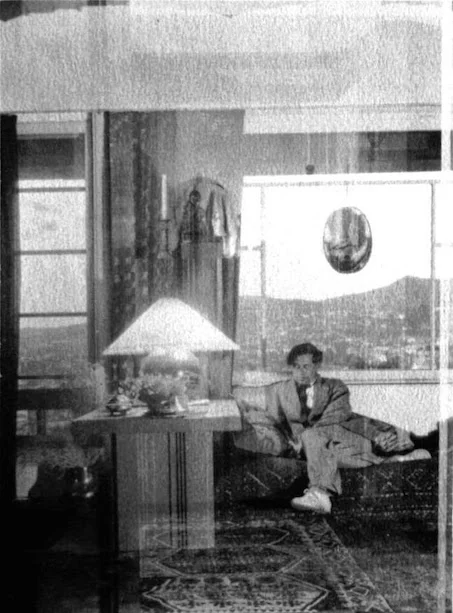 Herman Sachs in his living room in the Owner’s Unit at Manola Court, seated on a Schindler designed sofa next to a Schindler designed end table. Photo courtesy of Stephen Clauser, handler of the artist Pasquale Giovanni Napolitano’s Estate.