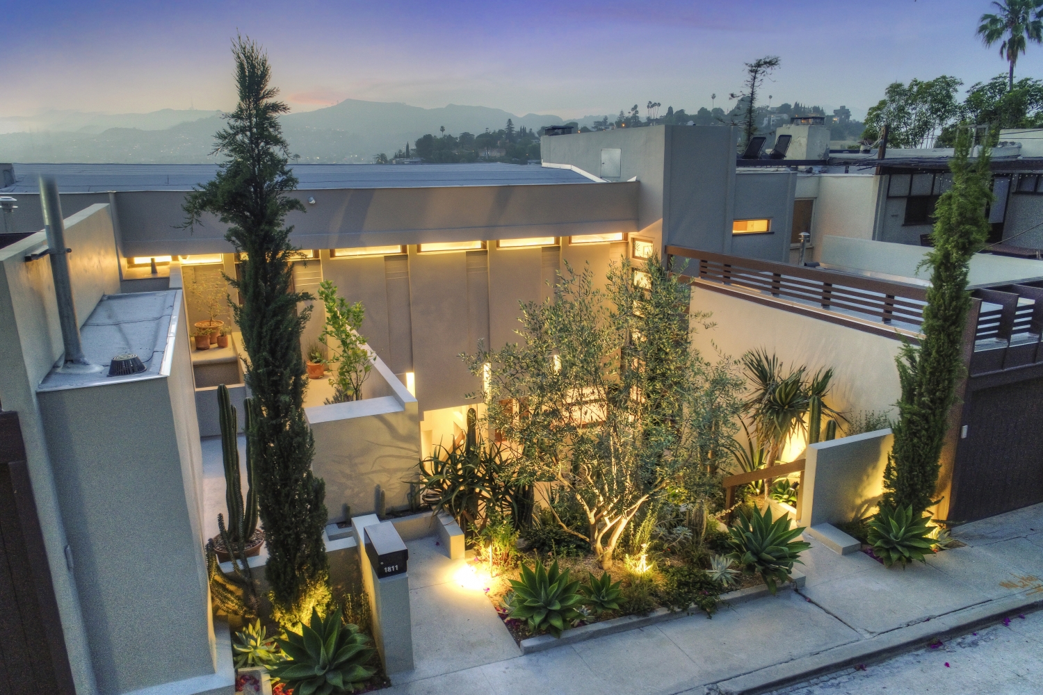 Overview of the Penthouse and adjacent cactus courtyard at Manola Court. 