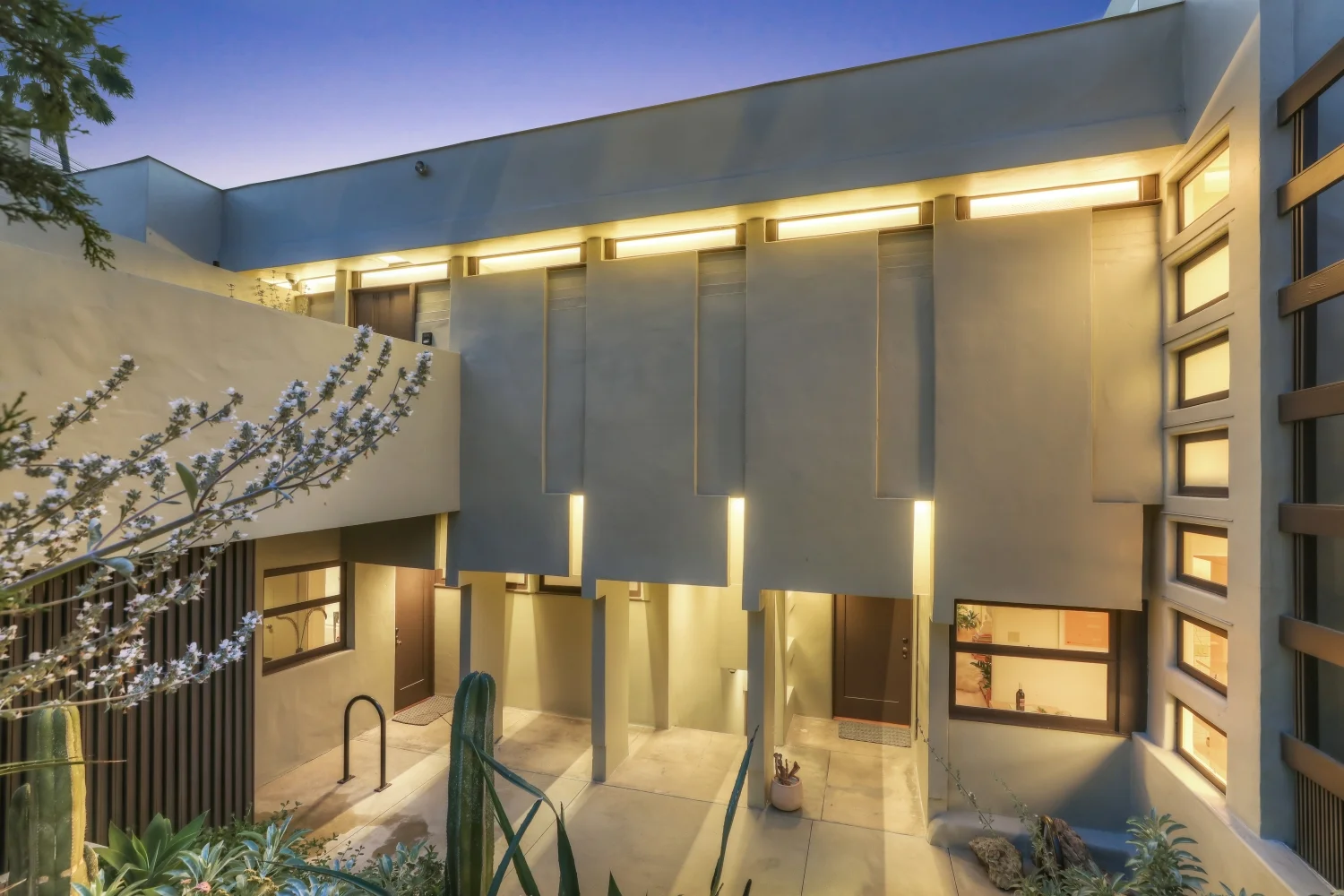 Entryways to the Penthouse (upper left), Music Room (lower left), and Maid's Room (lower right) at Manola Court.