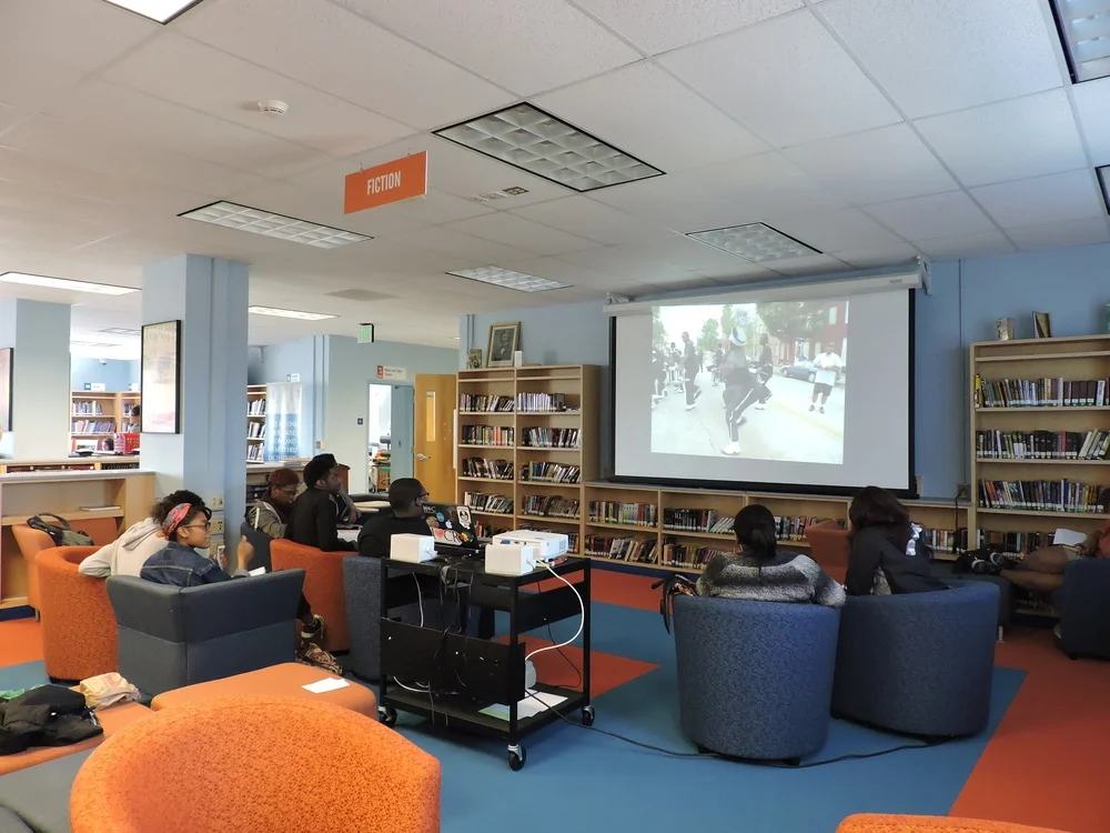 Students watching the documentary “Boys of Baraka”, based on a group of students from Baltimore who studied abroad in Kenya, Africa in 2005.