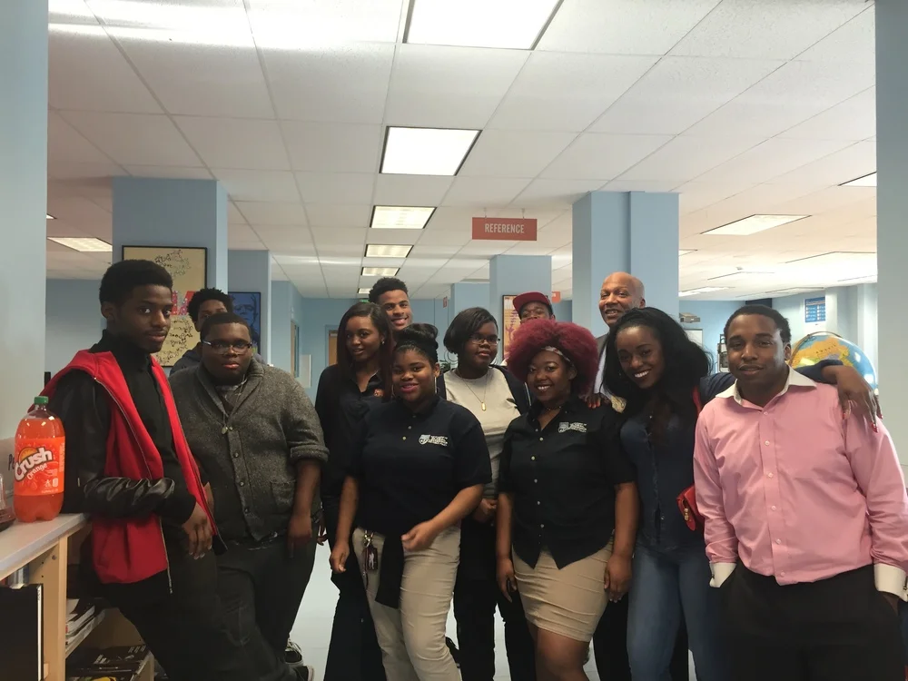 Muse 360 Director, Sharayna Christmas, students, and guest speakers Selwyn Ray and Devon Brown (far right), a former Baraka student.