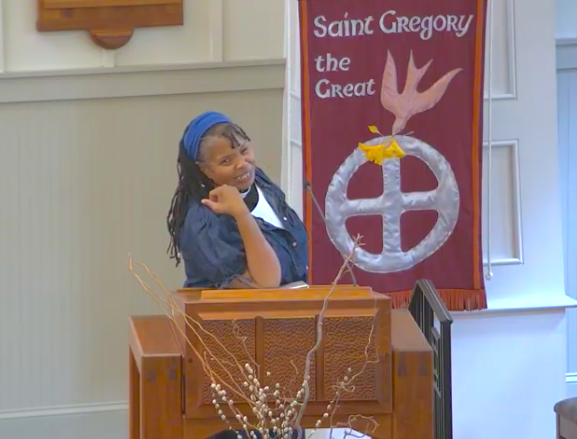 Nikki pulpit laughing.png