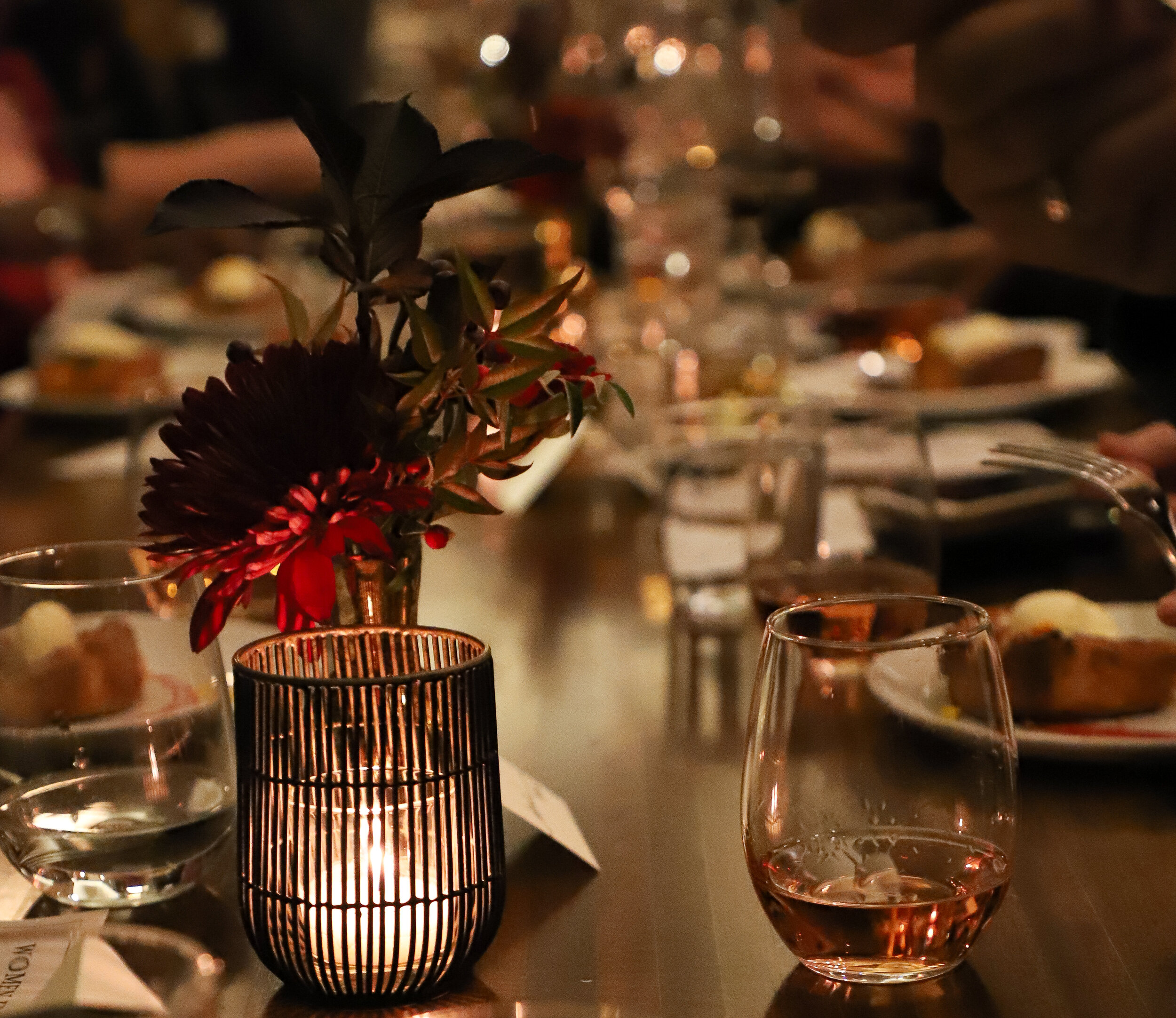 Intimate ambiance captured in a close-up of a candlelit dining experience.