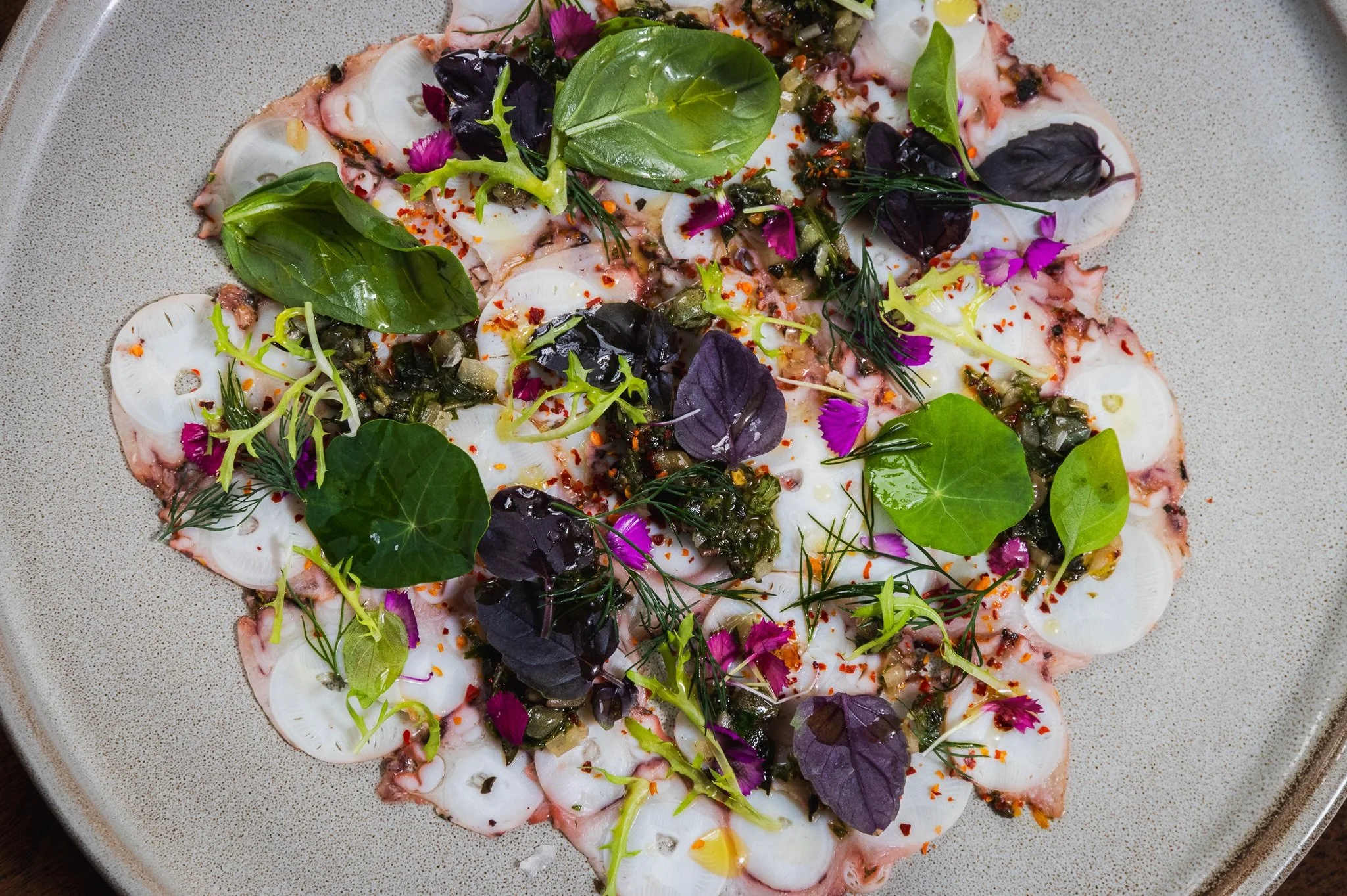 Octopus Carpaccio Siciliano &bull; peperoncino, orange, oreganata, caper