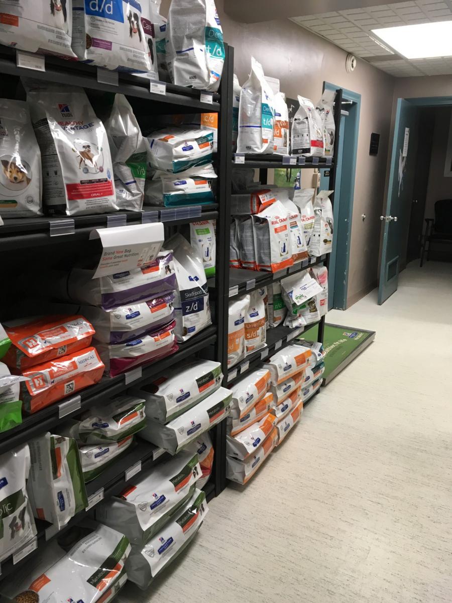  Animal Clinic of Regina’s shelves of dog food bags in the hallway to the exam rooms 