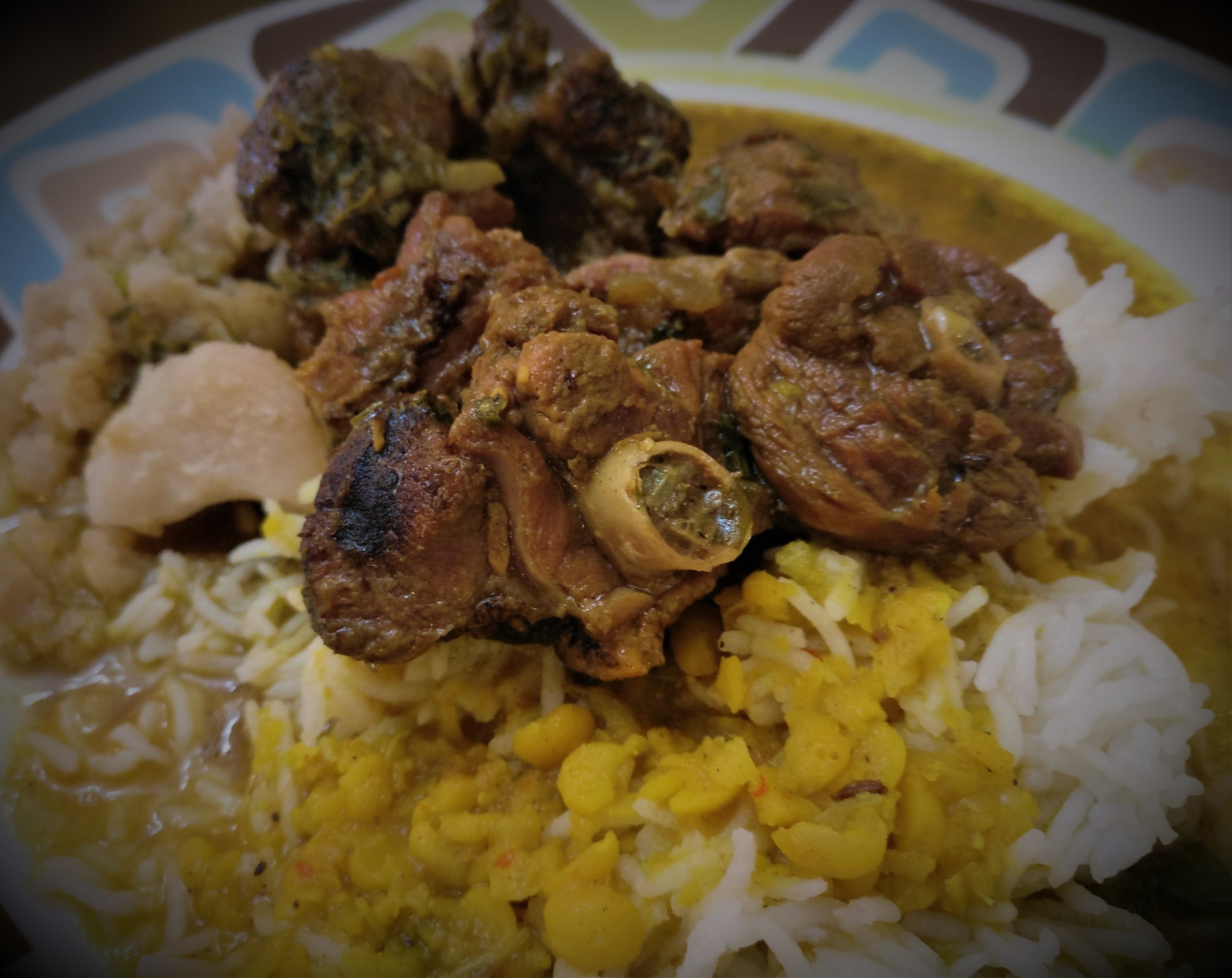 Curry duck on a bed of dhal and rice.