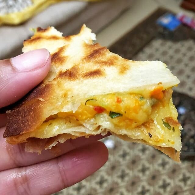 Trinidad Pepper Roti is just what this weather calls for! .
.
.
Pepper Roti is simply sandwiching a delicious potato filling with cheese, between 2 paratha rotis! That's it! It's easier said than done right 😂😁😜.
.
.
That's quite true. It can be a 