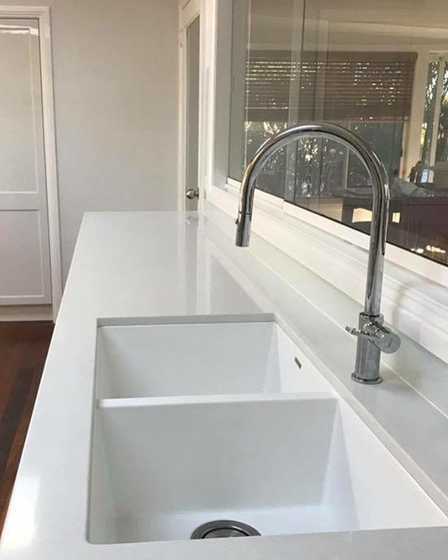 Clean, fresh and sophisticated..The white undermount sink works so well here with Essastone 'Pure Cloud' benchtops. A brilliant design choice by the client #lifestylestone #lifestyle #stone #stonemason #stonebenchtops #benchtops #kitchenrenovation #k