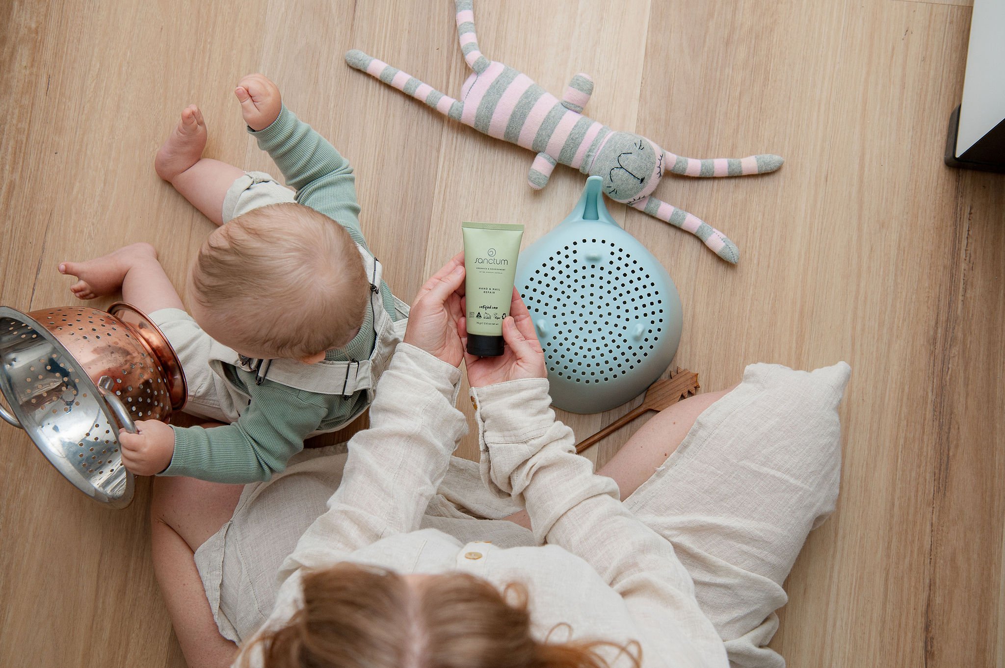Mum and toddler playing together during a lifestyle skincare photoshoot at home