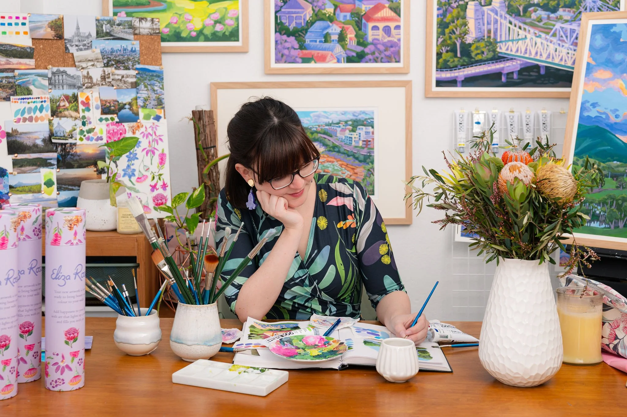Brisbane artist Eliza painting in her studio