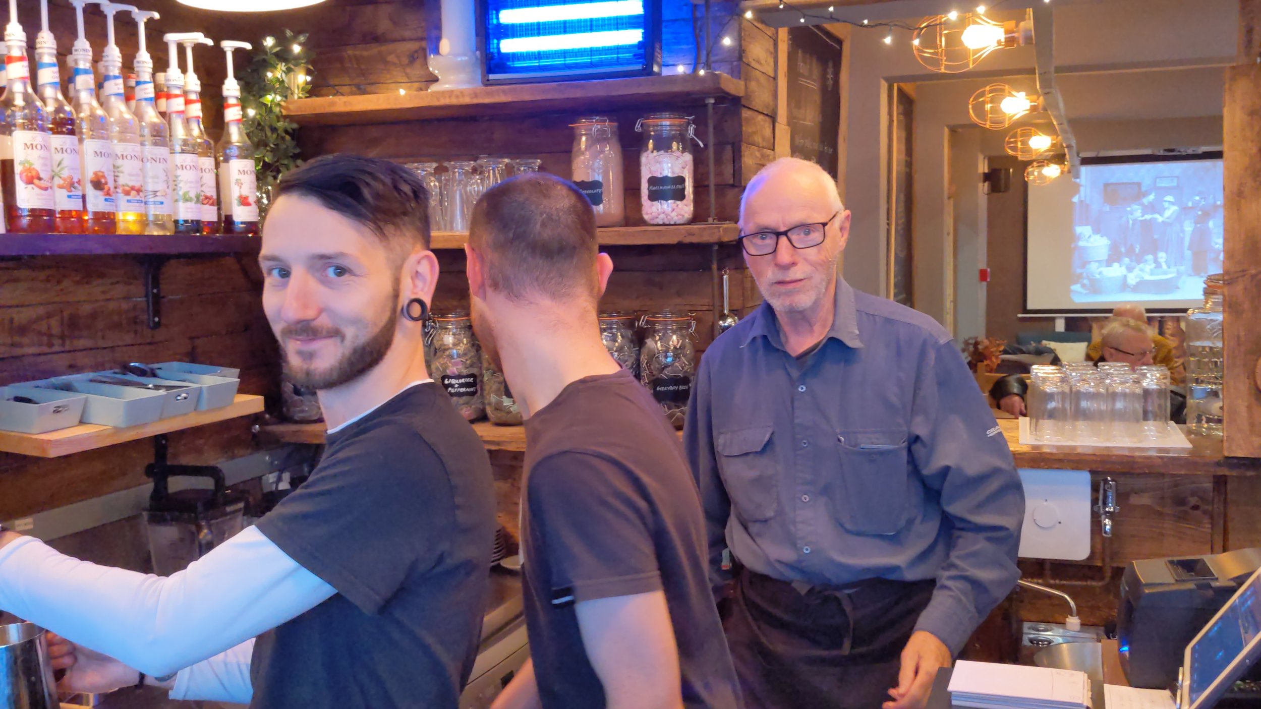 Staff and volunteers behind the bar at Vineyard Café on Post House Wynd, Darlington town centre.