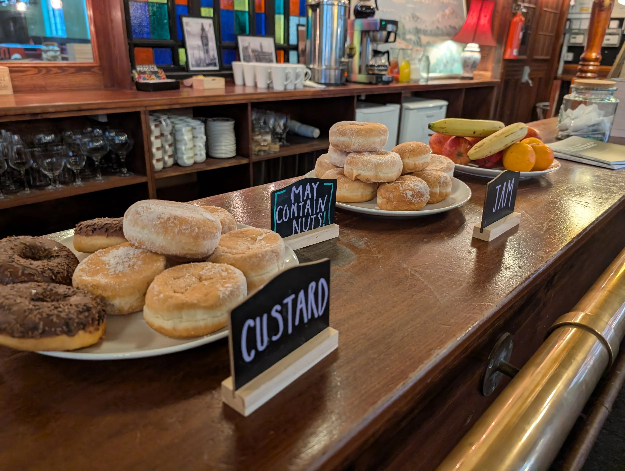 Doughnuts with allergen information and fruit available free of charge during a Sunday Service at Darlington Vineyard Church, Salt Yard.