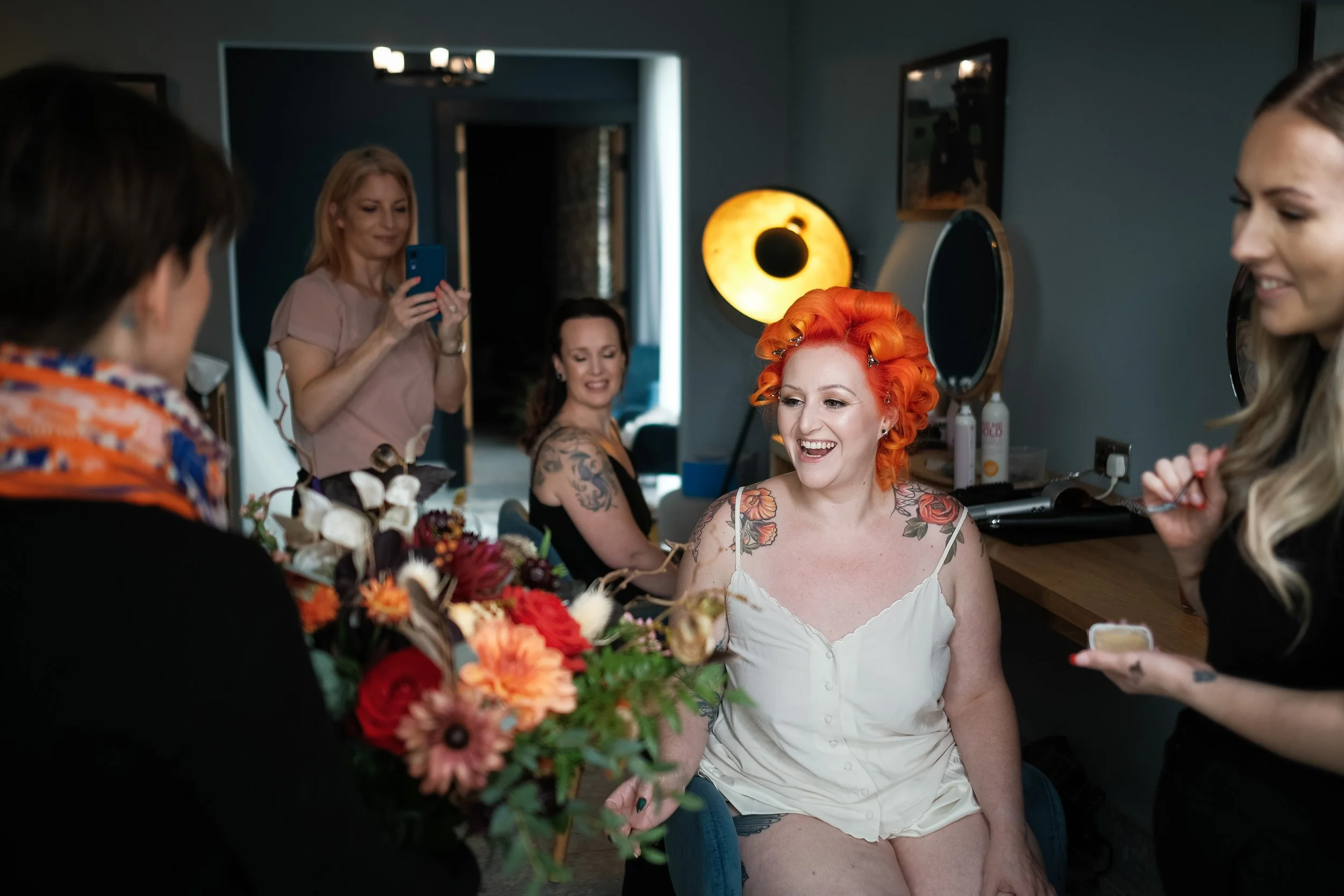 A brides look of happiness and surprise as she's presented with her wedding bouquet