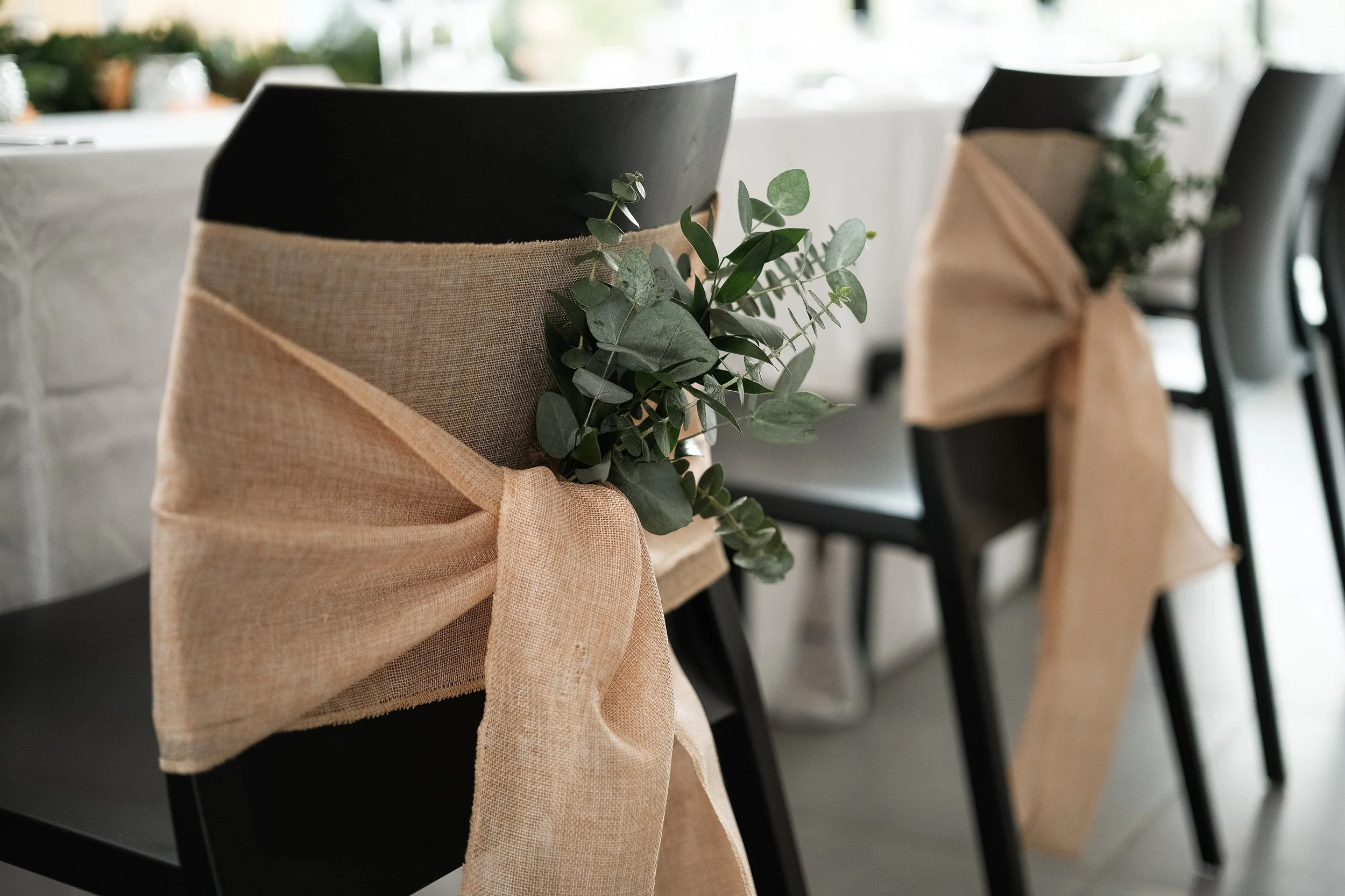 Eucalyptus in a hessian sash ready for a wedding ceremony