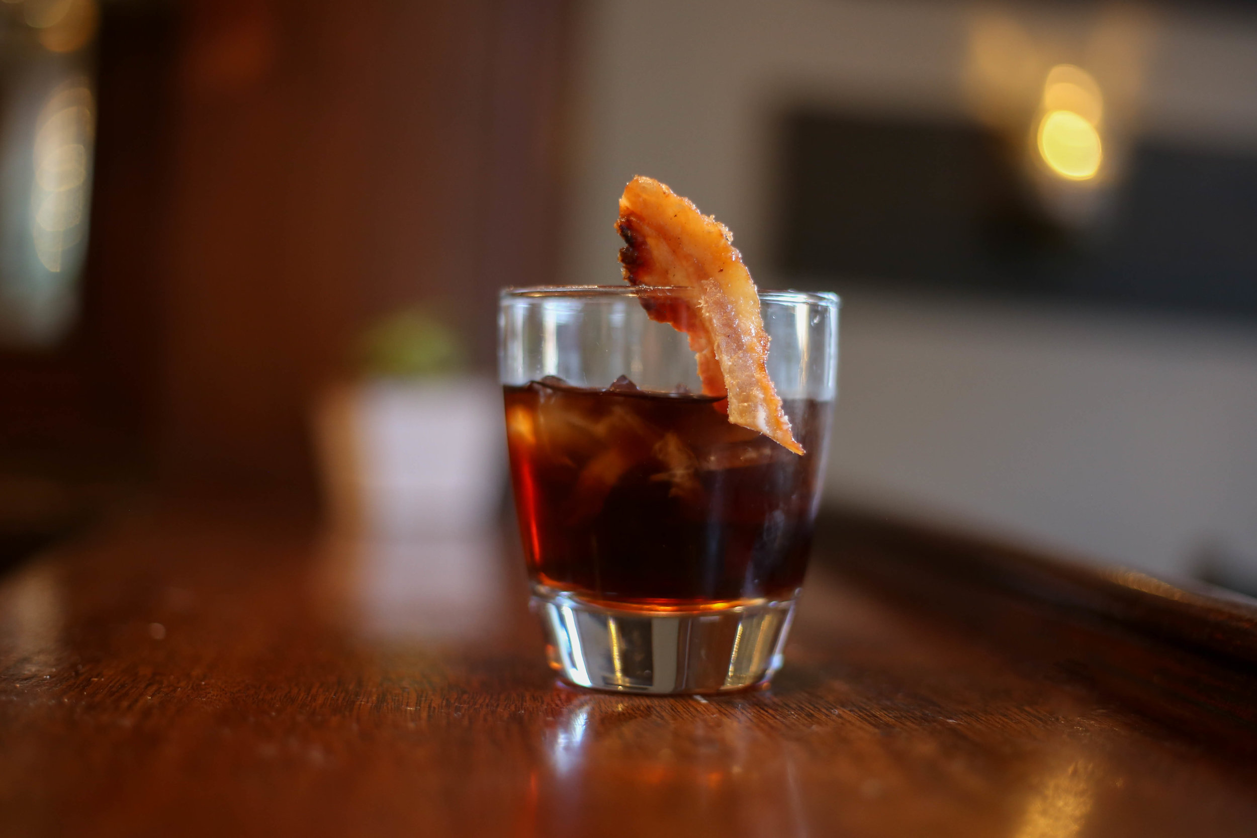 Bacon Whiskey on bar editorial image