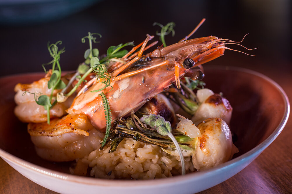 XXL Prawn in dish with lavender on rice