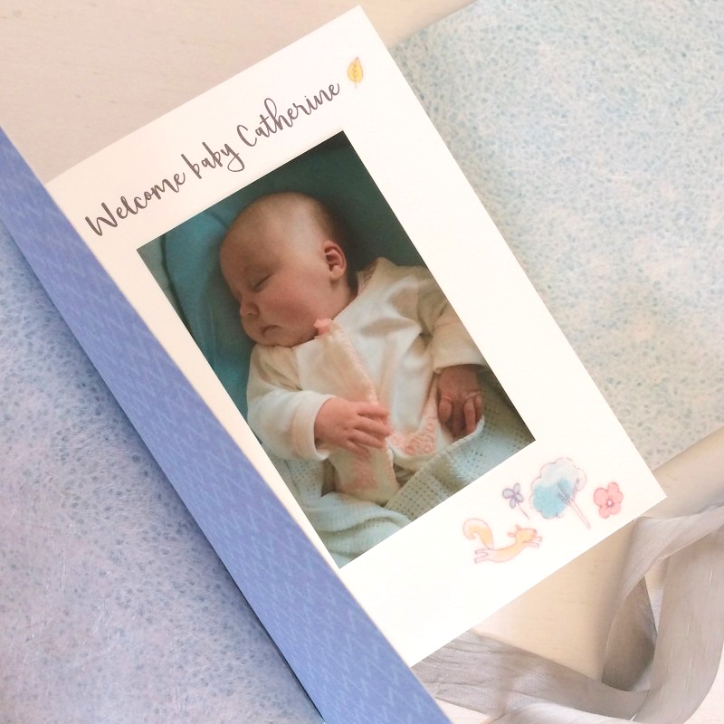 Baby's birthday cards bound into book with mementos