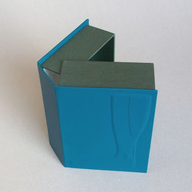 Handmade clamshell box with foot embossed on cover