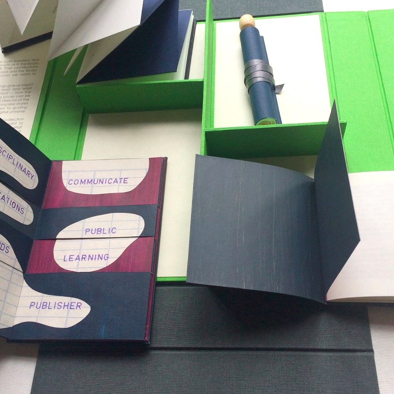 4 handmade artist's books in archival box with navy, pink, green and grey colours