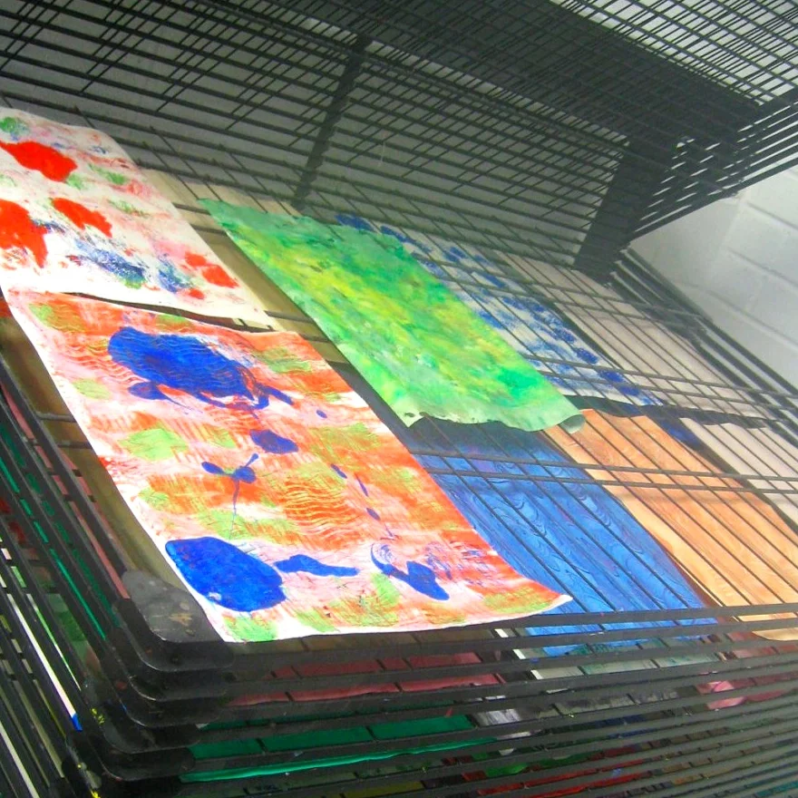 Handmade patterned paper on drying rack