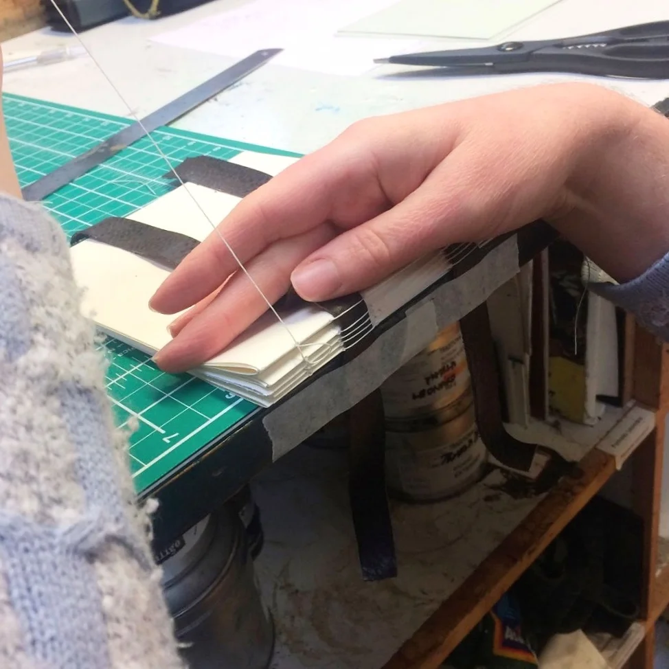 Binding the spine of a book