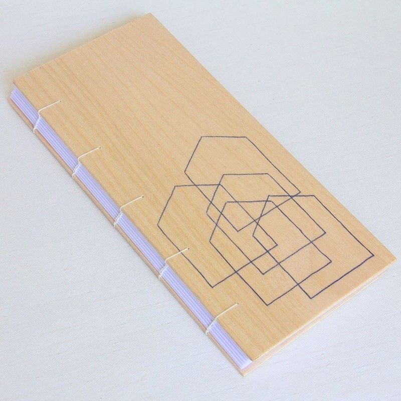 Artist's book with wooden cover with house outline drawing by artist eilis murphy