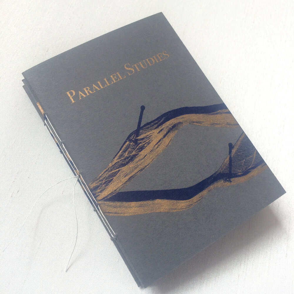 Handmade artist's book with grey card cover with navy and gold text and image by artist eilis murphy
