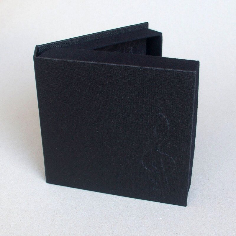 Exterior of clamshell box with clef embossed on cover