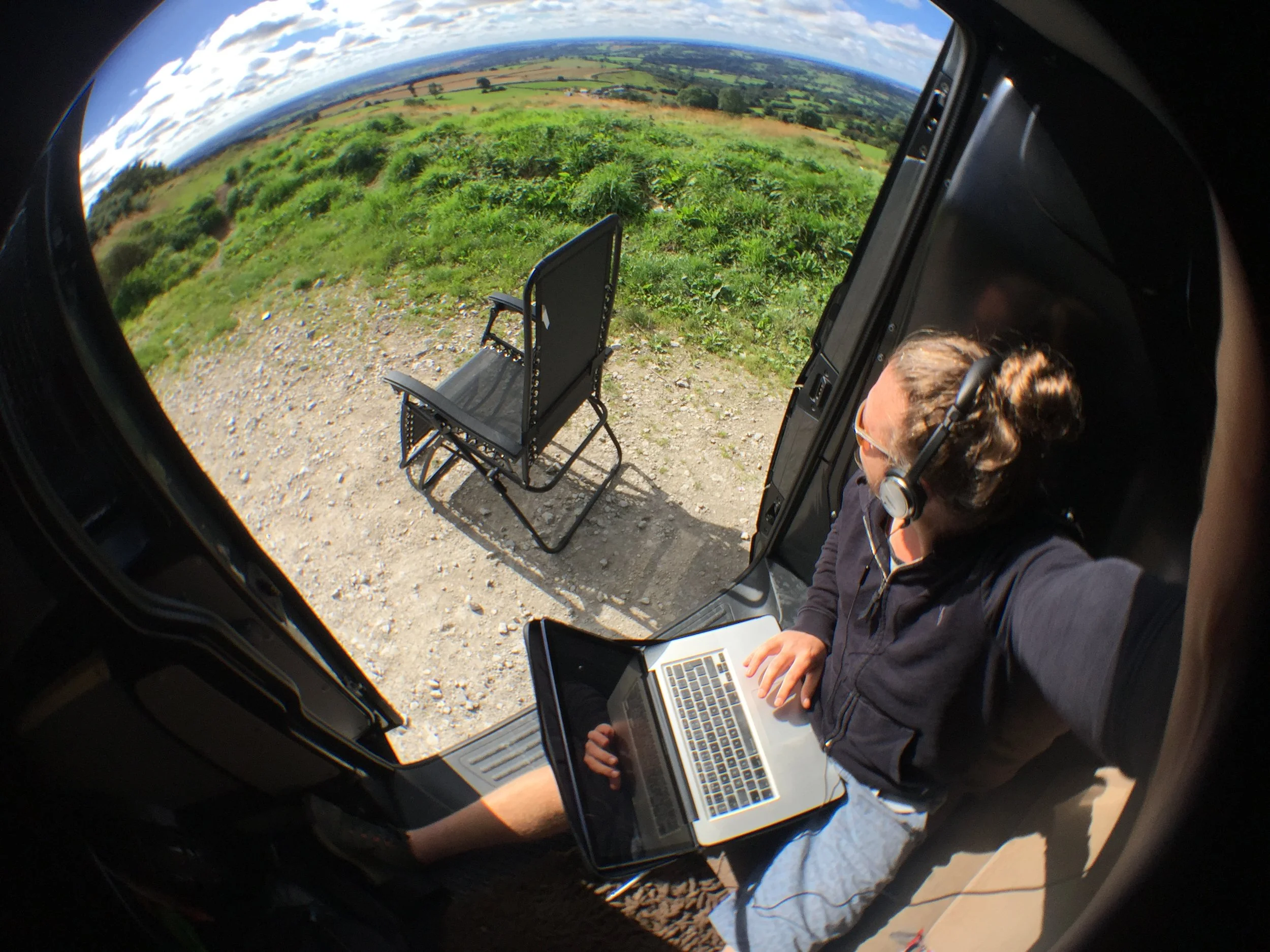 Parking spot on Hollin Bank Road Leon in van with laptop.JPG
