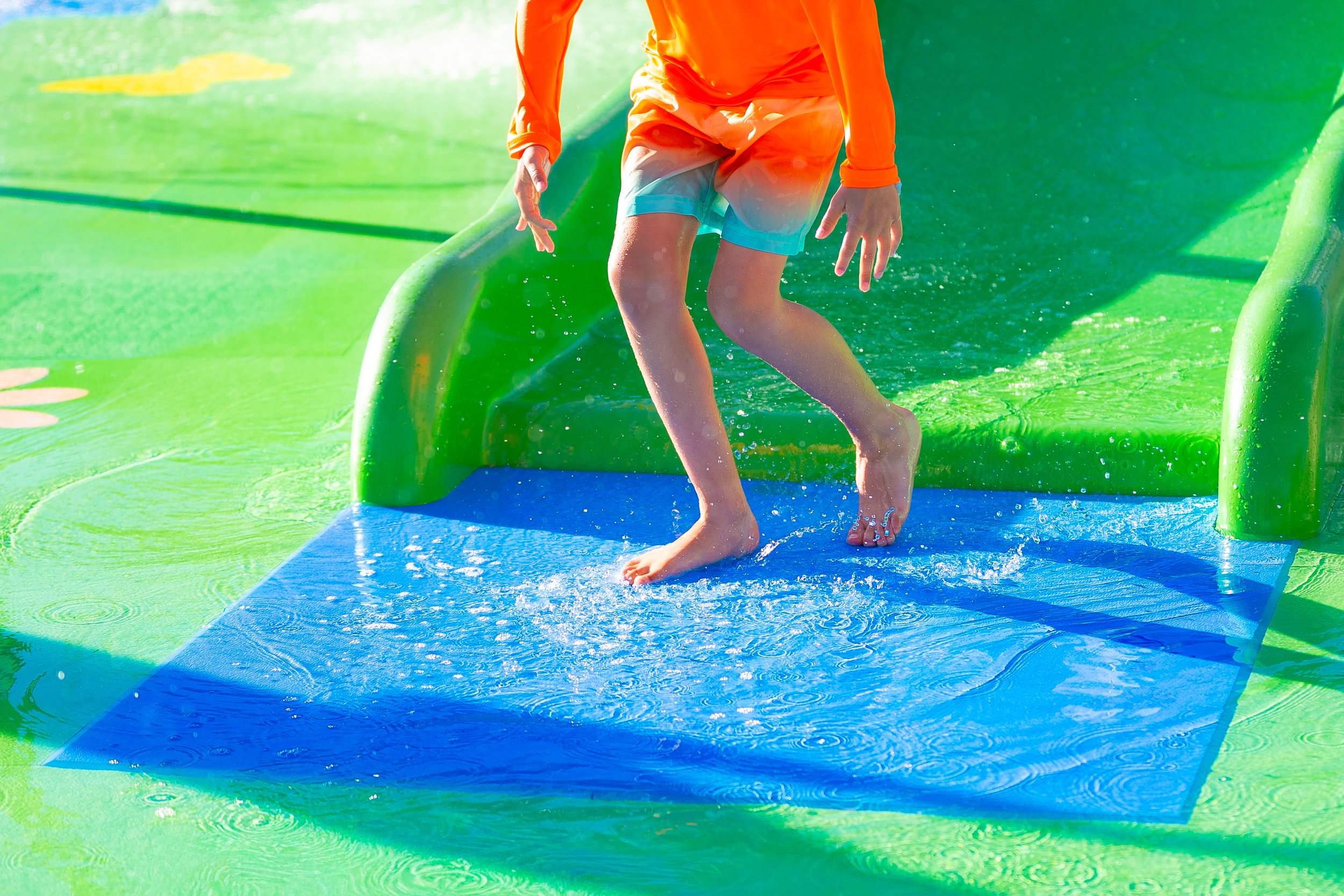 Boy on slide landing pad, Life Floor landing pads, slide landing pad