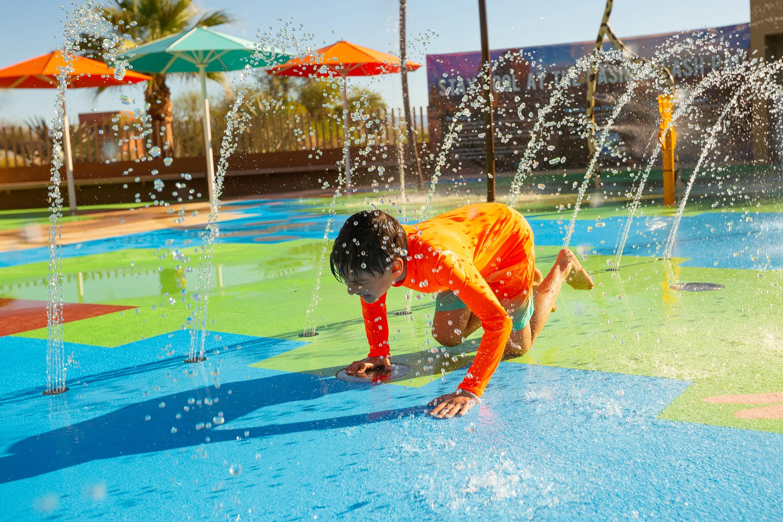 Boy crawling on Life Floor Aquatic Safety Surfacing, Splash Pad Tiles, Splash Pad Safety