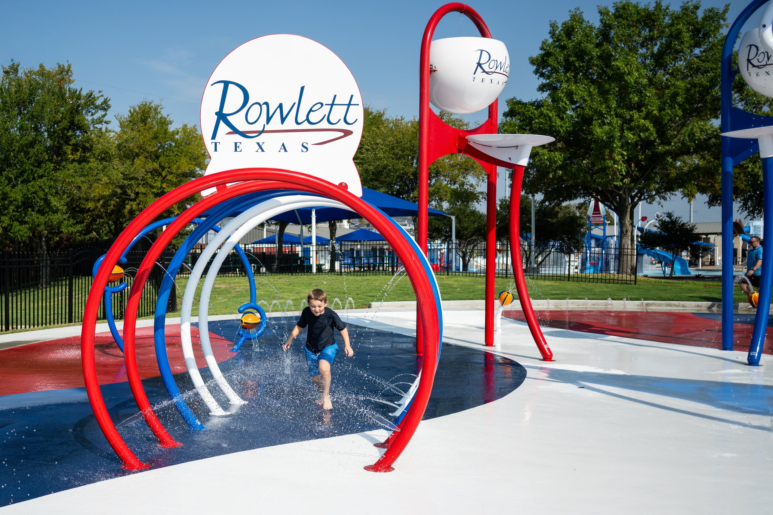 Children play on Wet Zone Waterpark's splash pad featuring Life Floor's slip-resistant safety  tiles