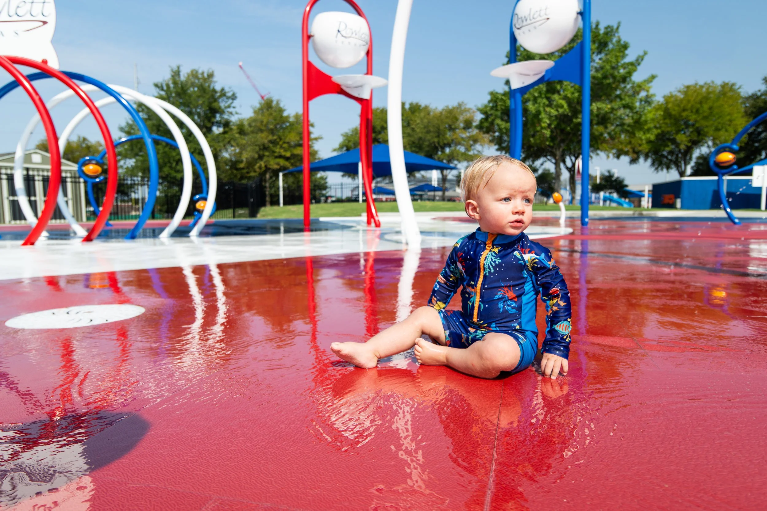 Custom-cut Life Floor curves flow between Waterplay spray features at Wet Zone Waterpark in Rowlett, TX