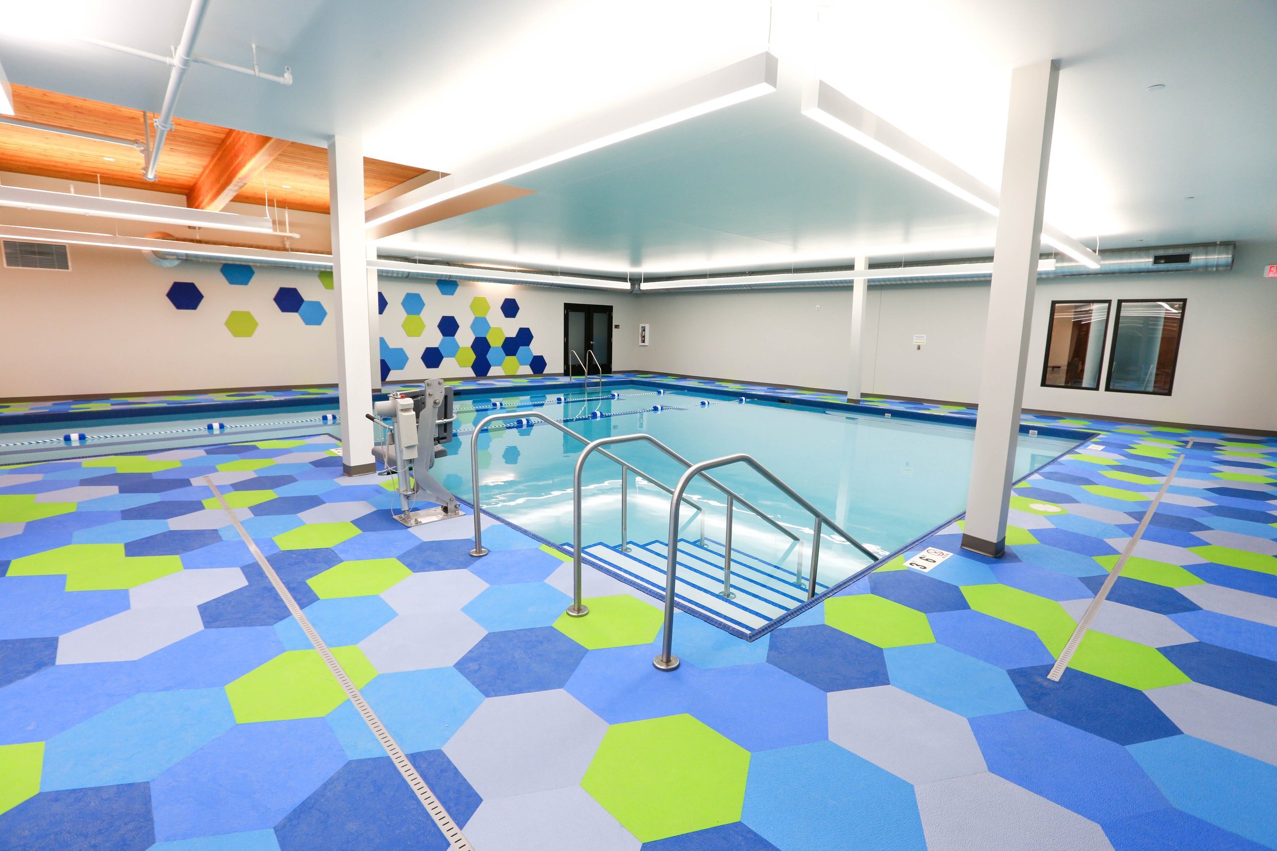Indoor pool with hexagon pool tiles, Life Floor swimming pool floor