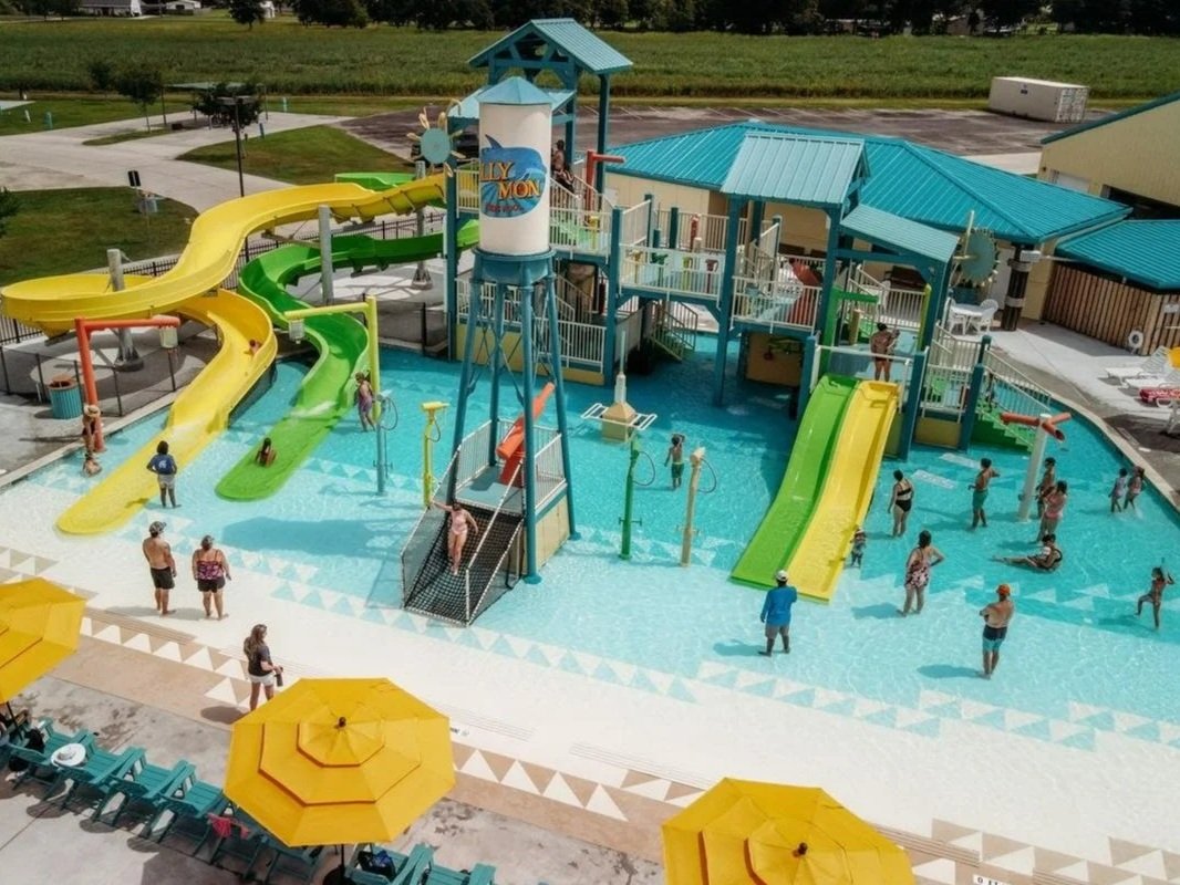 Camp Margaritaville Breaux Bridge waterpark area with guests playing on Life Floor splash pad flooring, water park theme ideas, aqua tile, splash pad tiles, splash pad surfacing