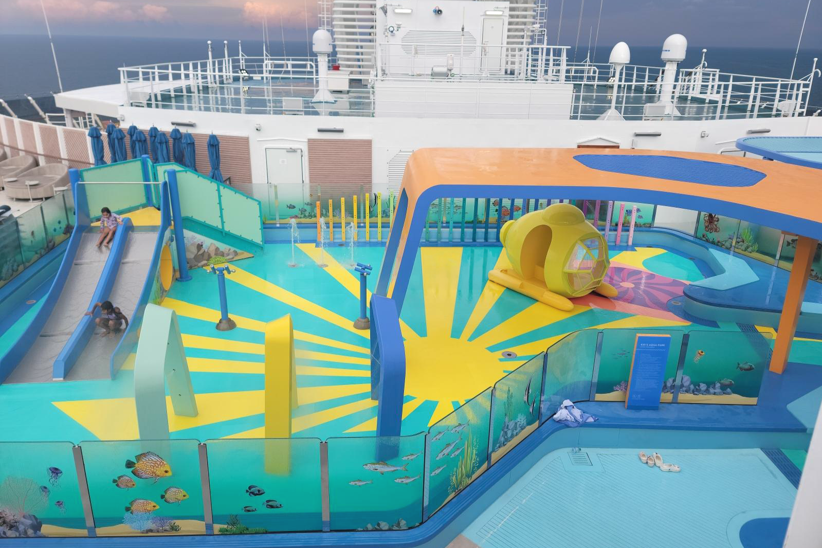 Norwegian Cruise Line's Aqua, Aqua Splash Park with Life Floor safety surfacing, children playing, slides, water features.