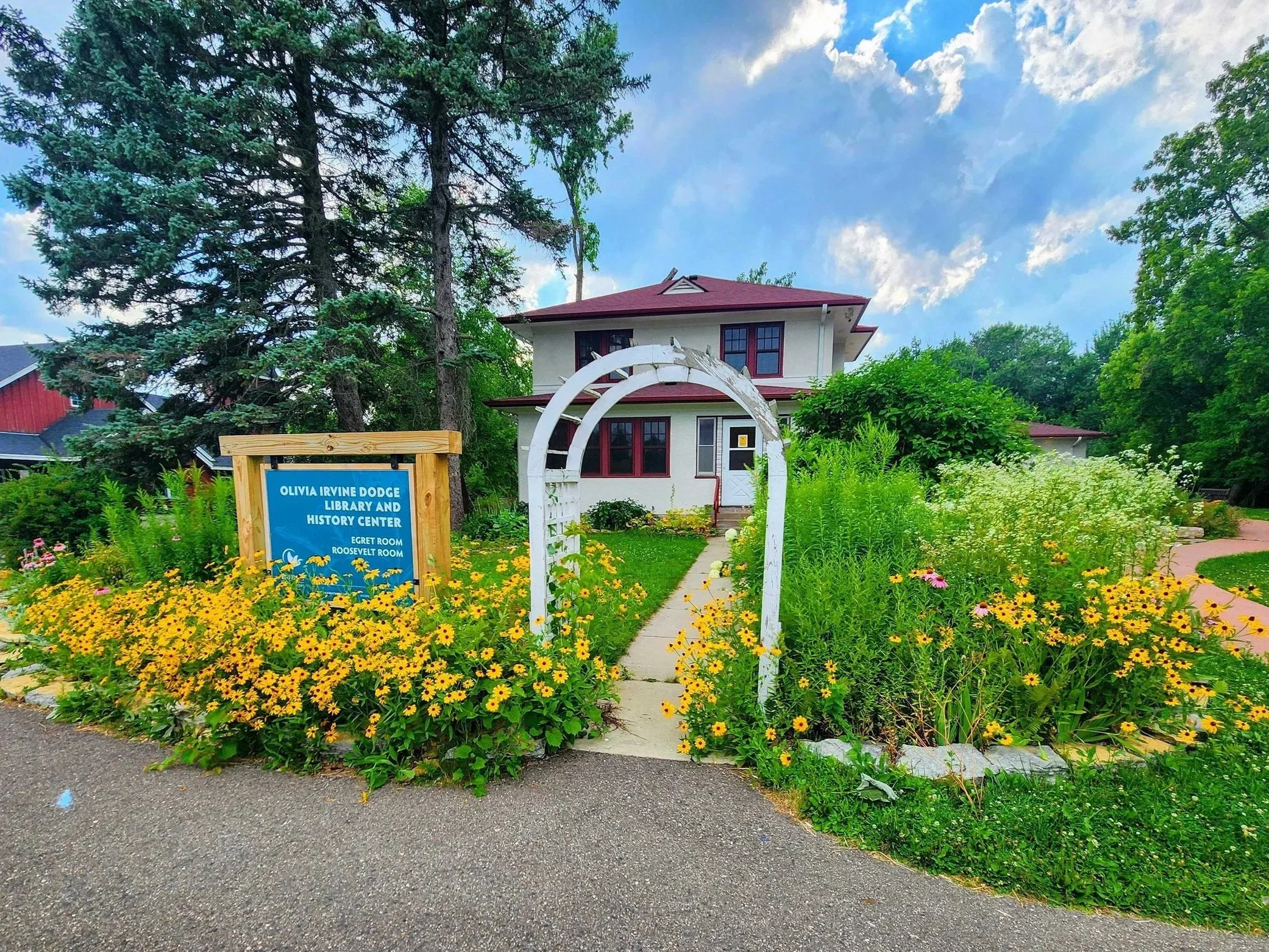 Photo of Dodge Nature Center Sign and flowers