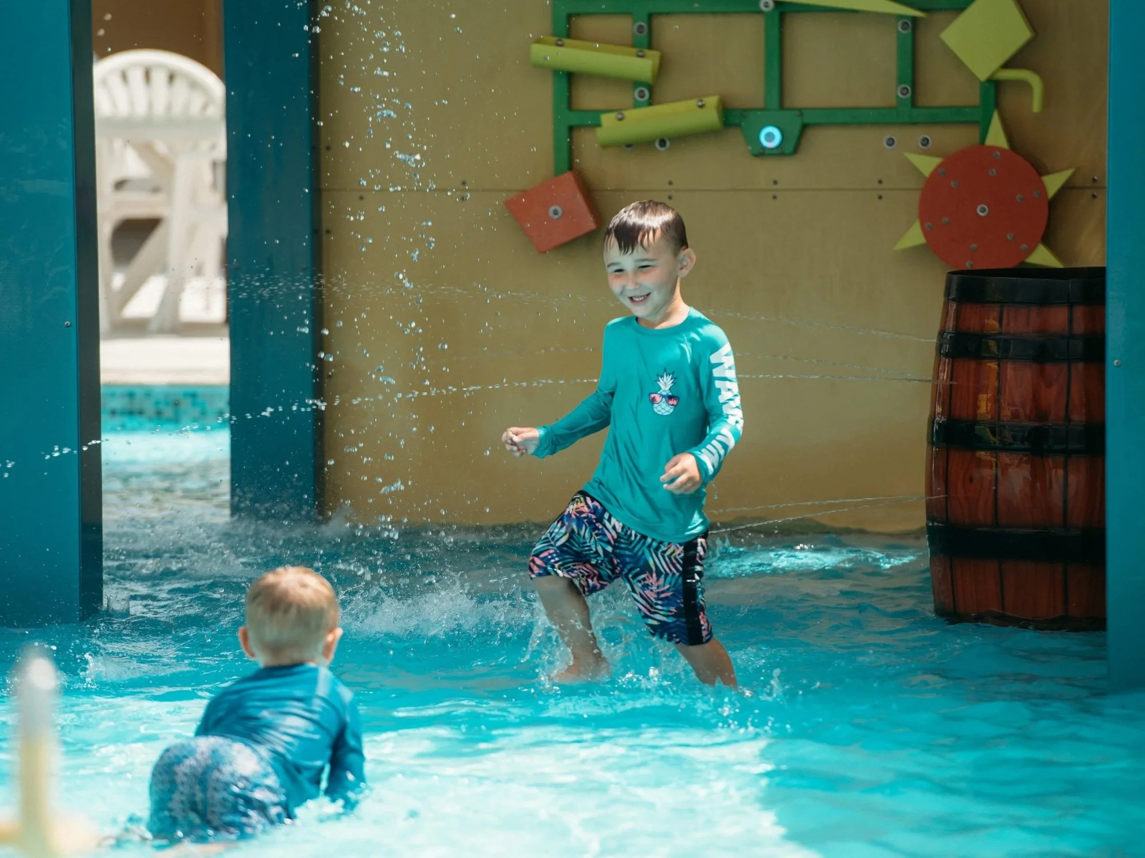 Children playing in waterpark at Camp Margaritaville Breaux Bridge on Life Floor splash pad tiles, splash pad safety surface, splash pad surfacing