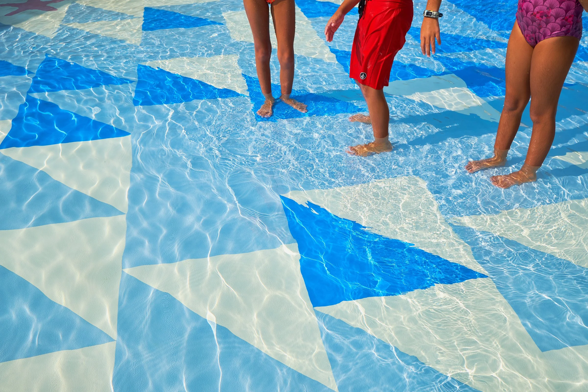 Children's feet on Life Floor aquatic safety surfacing, nsf, astm, safety tiles