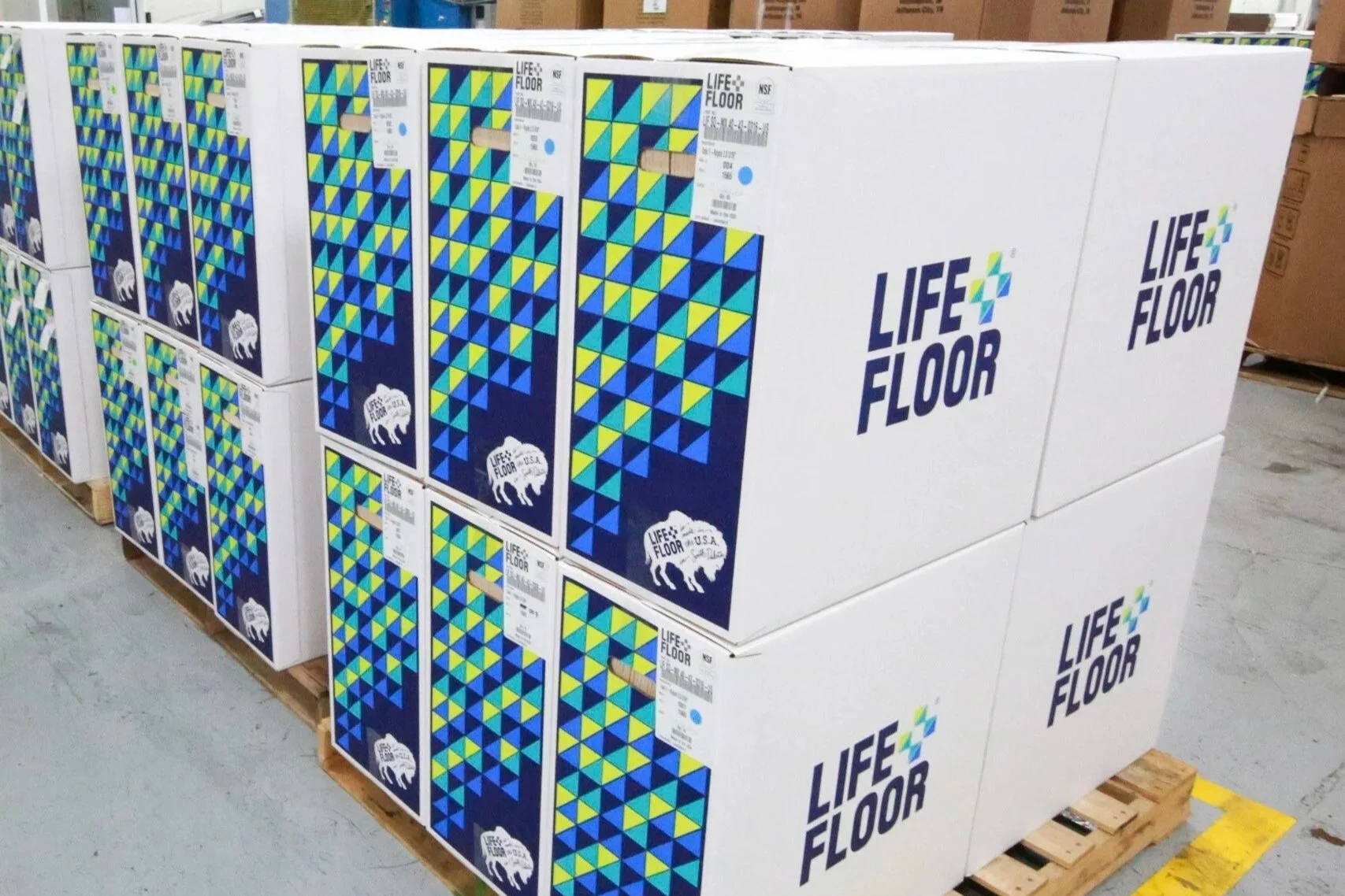 Life Floor boxes on pallets in warehouse