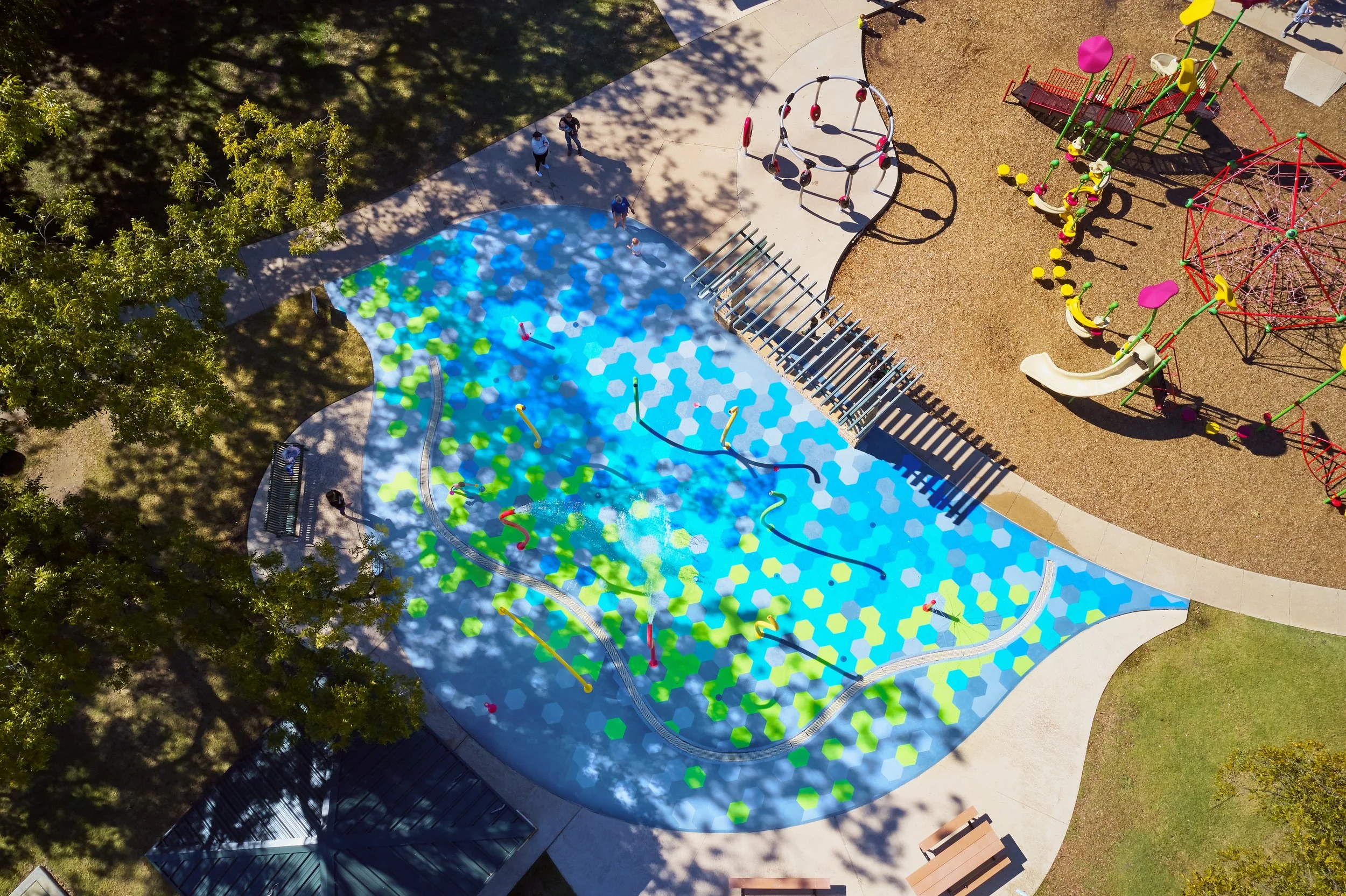 Aerial photo of splash pad with Life Floor hexagon pool tiles, aquatic safety surfacing, splash pad tiles