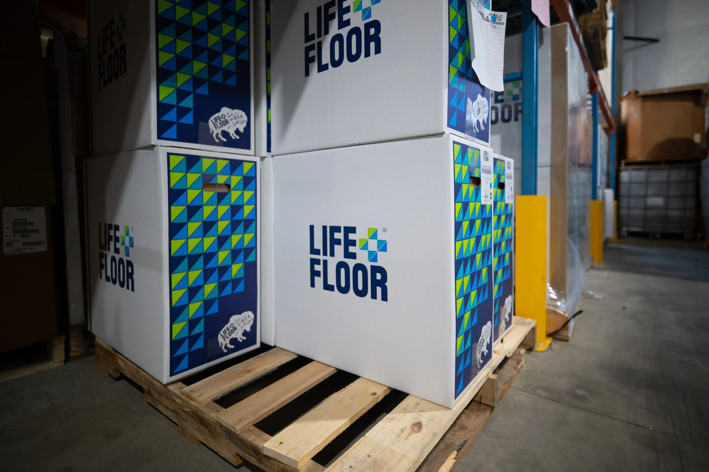 Stacked Life Floor boxes on pallets